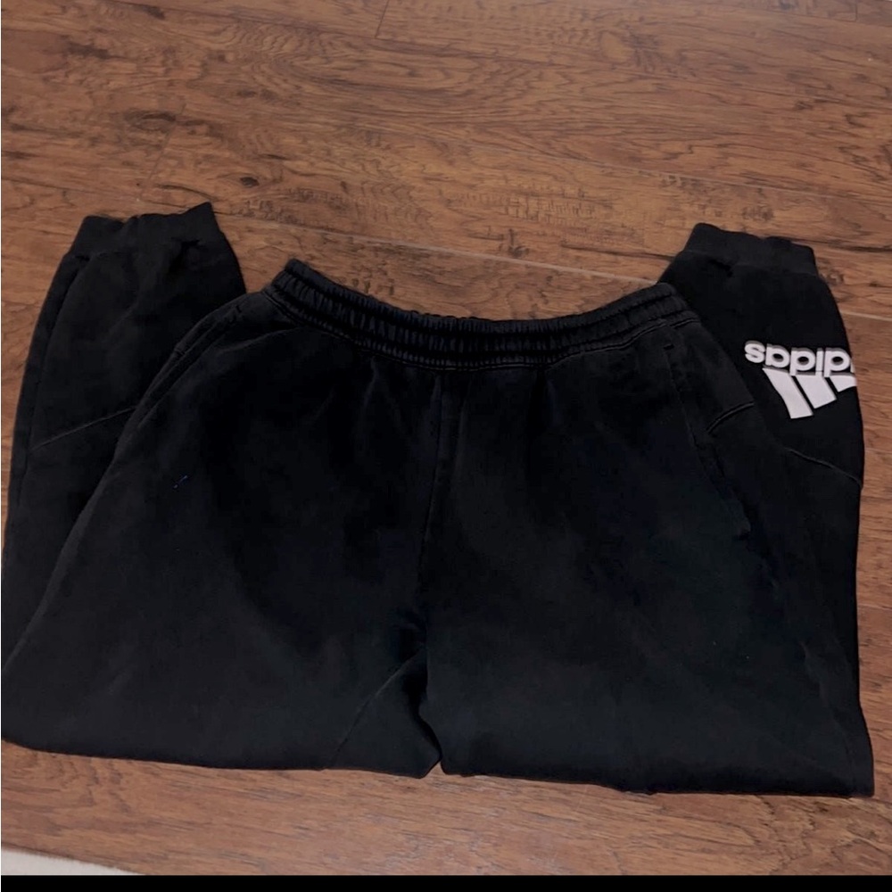 Black mens adidas joggers with light fade.